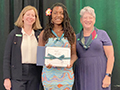  Gaia Godinho poses with her Gold Award from the Girl Scouts.